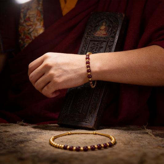 Kailash Way Gold Garnet Triumph Healing Bracelet worn on wrist
